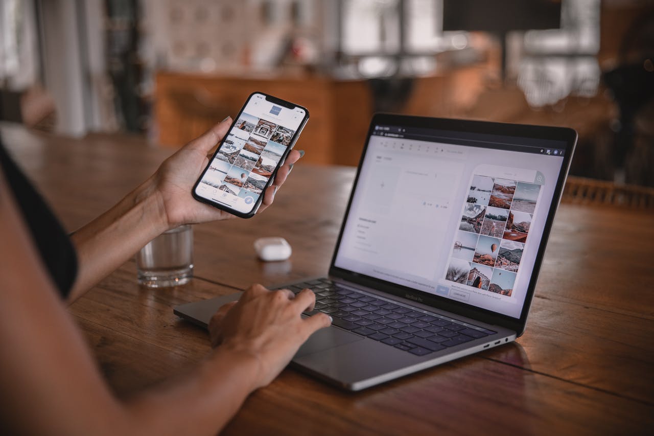 Mastering the First Impression: Your intriguing post title goes here Woman edits social media content on phone and laptop at a cafe in Bali.