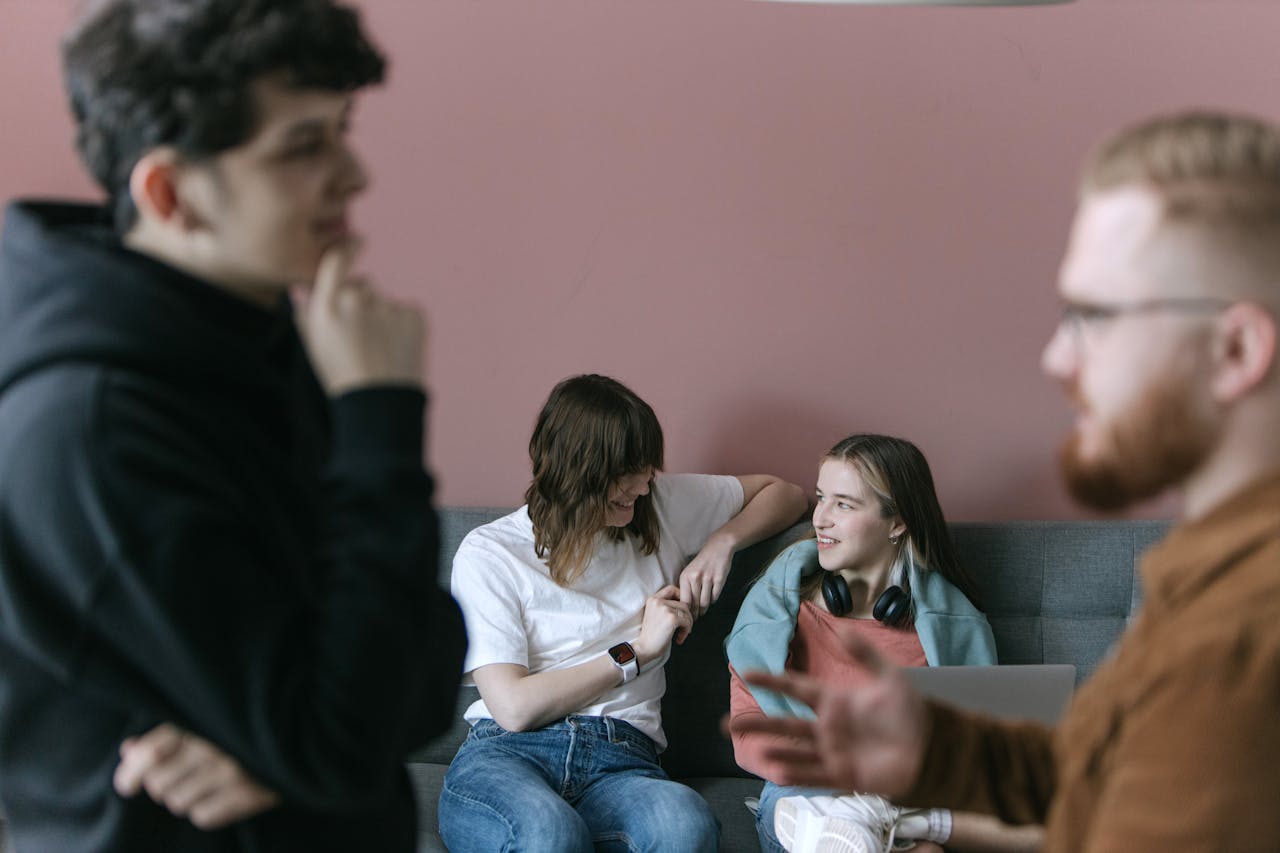 Crafting Captivating Headlines: Your awesome post title goes here Young professionals engaging in a relaxed and collaborative office meeting with a warm and inviting atmosphere.